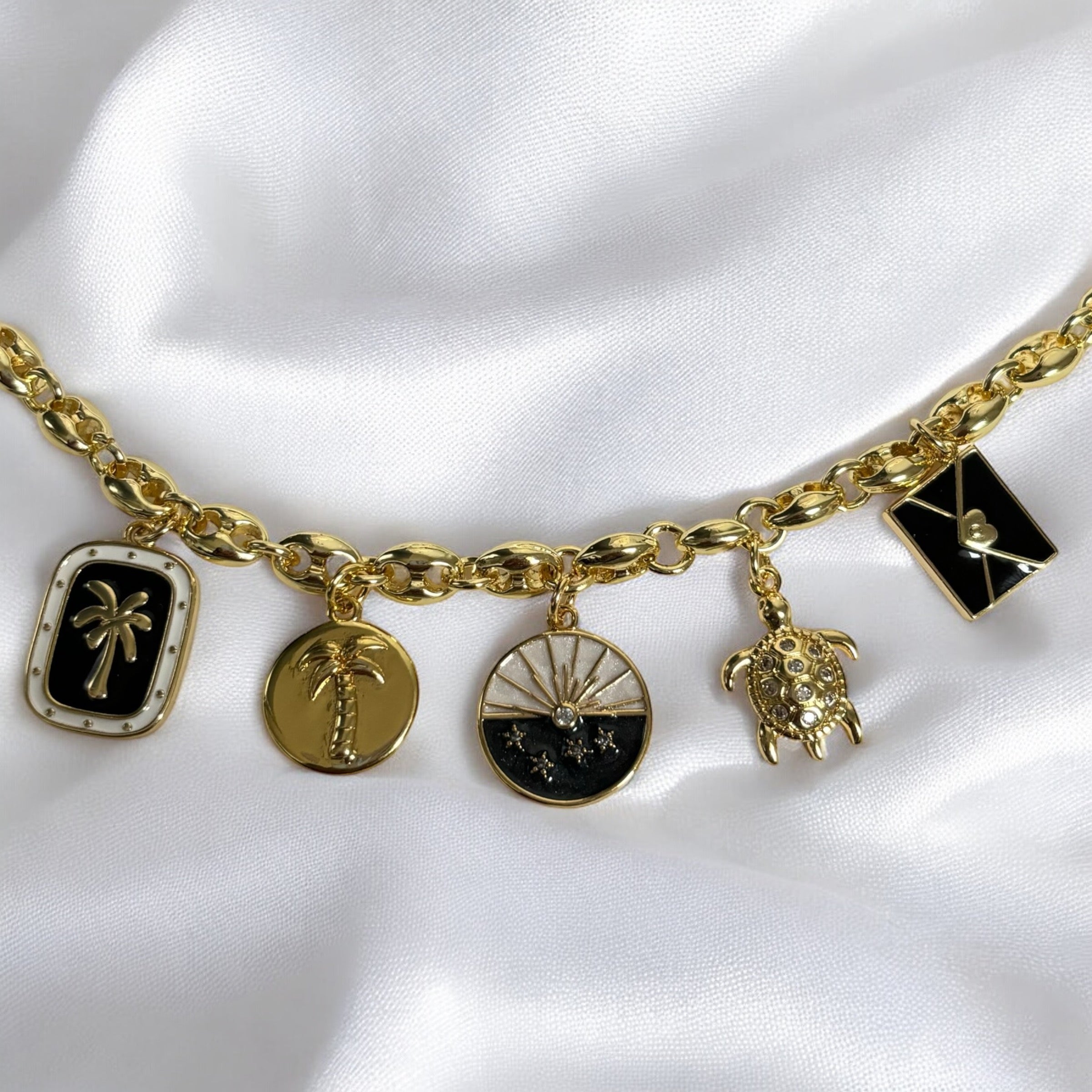 Uira | Noir Ocean Gold Charm Necklace
